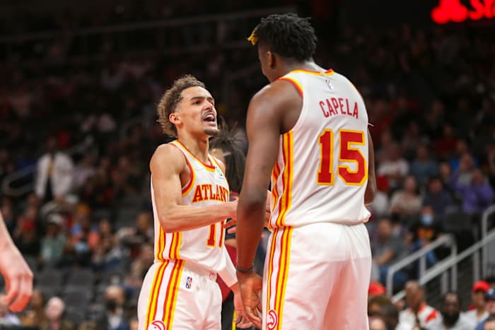 Trae Young motivates Clint Capela.